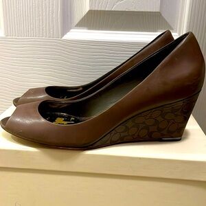 Coach wedges size 7. Brown leather with beautiful coach decal on wedge.